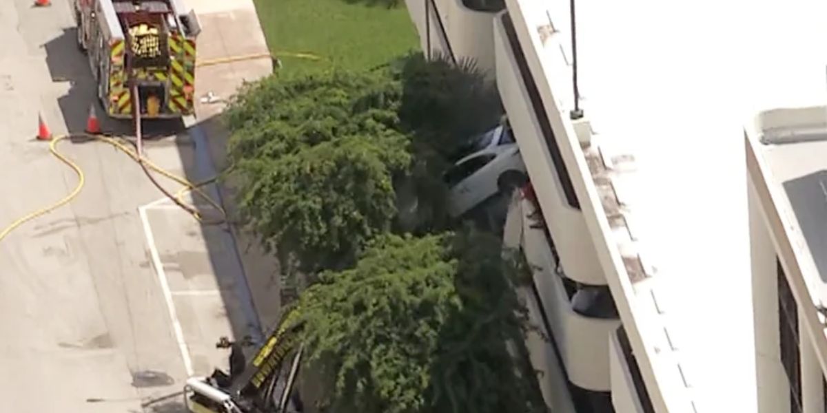 Dramatic Accident: SUV Left Dangling from Coral Gables Parking Garage After Crash; Woman Rescued