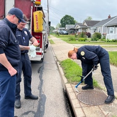 Akron firefighters rescue trapped baby goose from storm sewer